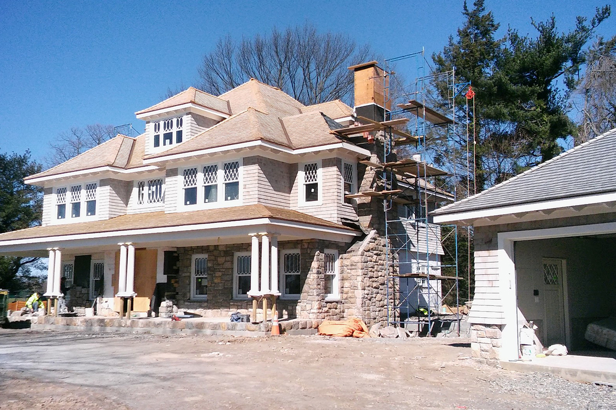 New home construction with stone chimney from Highland Builders Corp. in Westchester and Fairfield Counties.