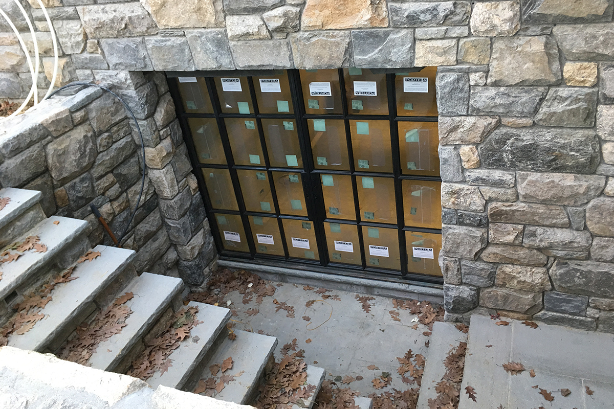 New home construction - exterior stone work on side entry from Highland Builders Corp. in Westchester and Fairfield Counties.