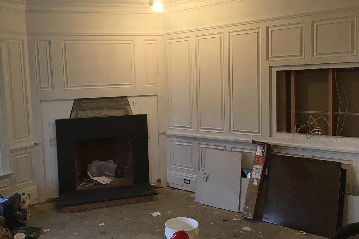 Fireplace, panel walls, flatscreen tv enclosure - custom interiors from Highland Builders Corp.